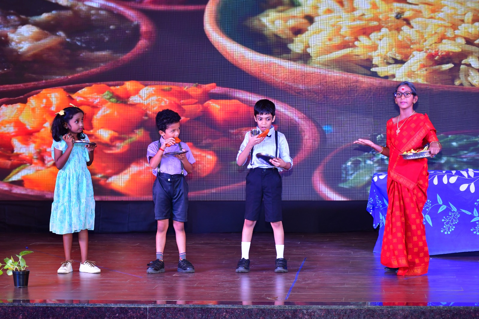 Students performing a cultural awareness skit on stage